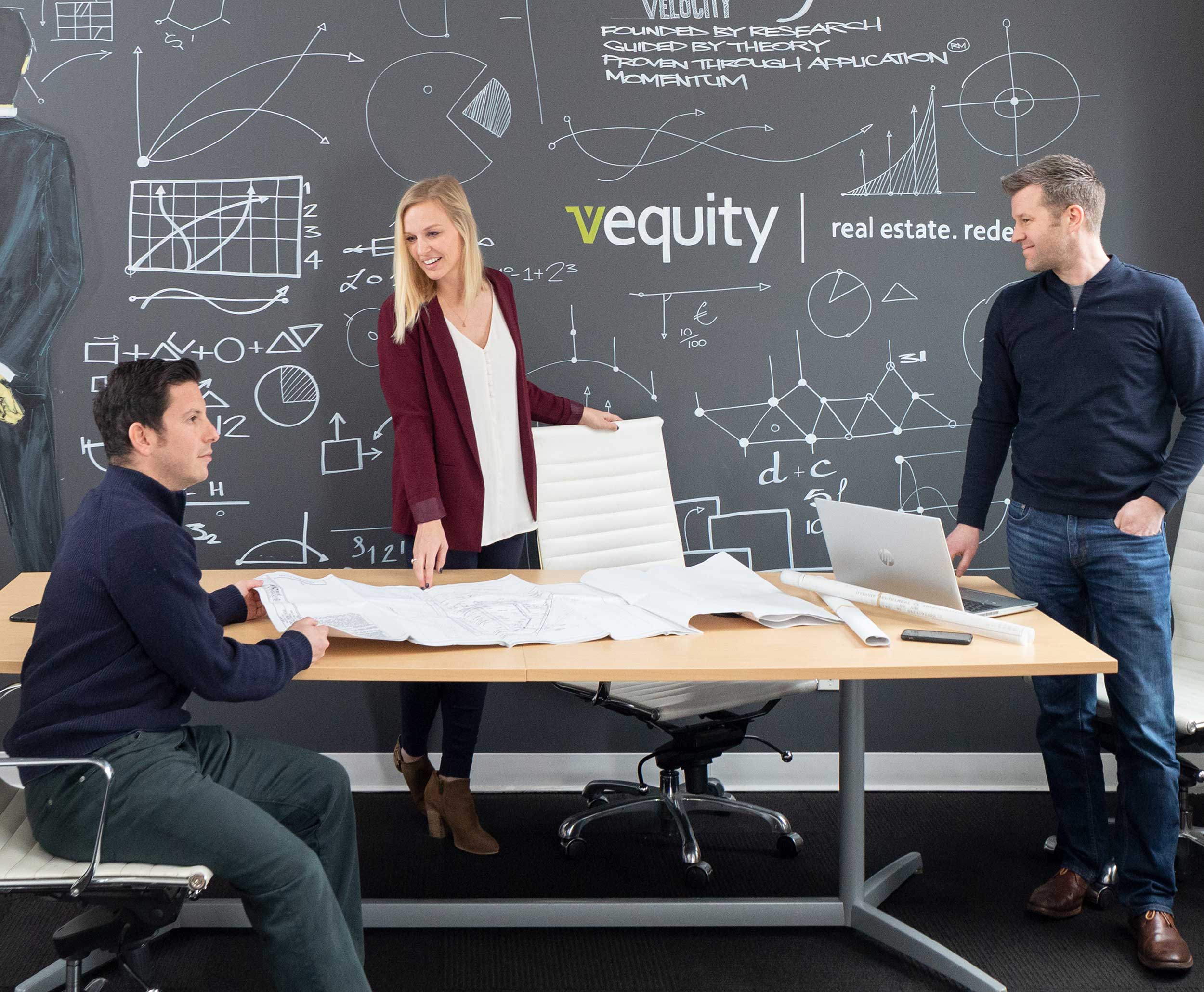 Employee discussion at Vequity corporate headquarters